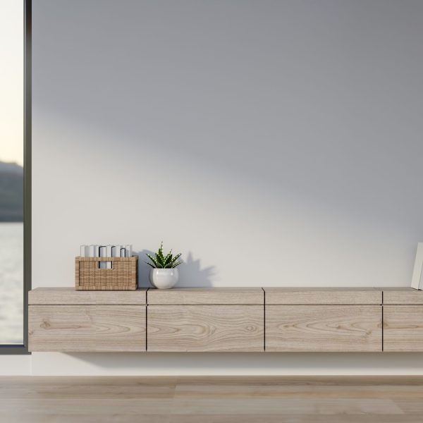A wooden build in counter with books and decors on the wall beside glass door of a seaside view room. Water Scenery, 3D rendering, 3d illustration.