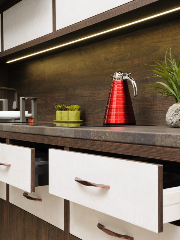 Luxury cozy modern dark brown kitchen, induction stove, minimalistic clean design. some drawers are open